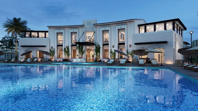 Hotel building and pool at dusk